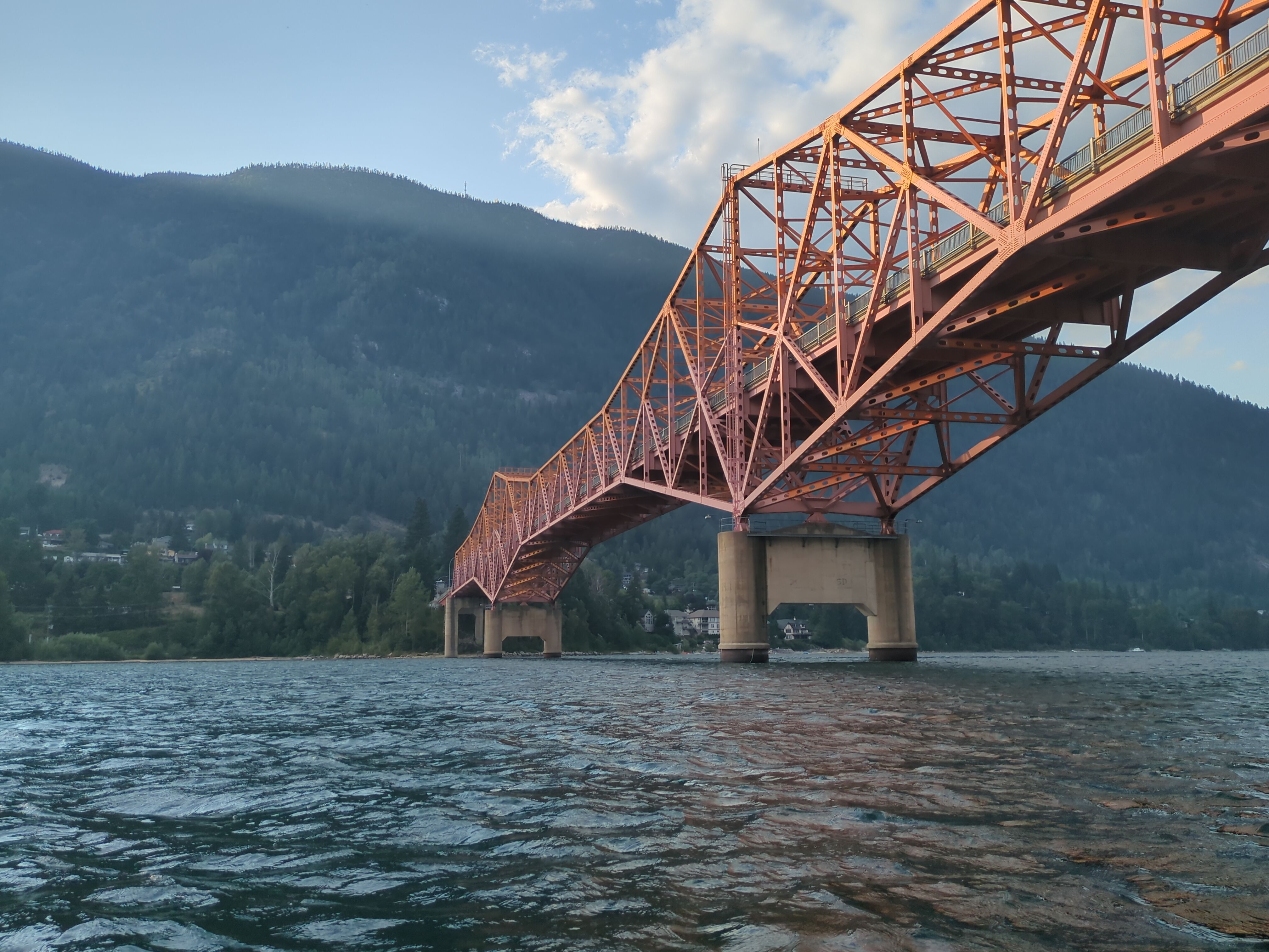 Nelson city bridge, called BOB, i.e. Big Orange Bridge, from the perspective of a person in a kayak underneath it.