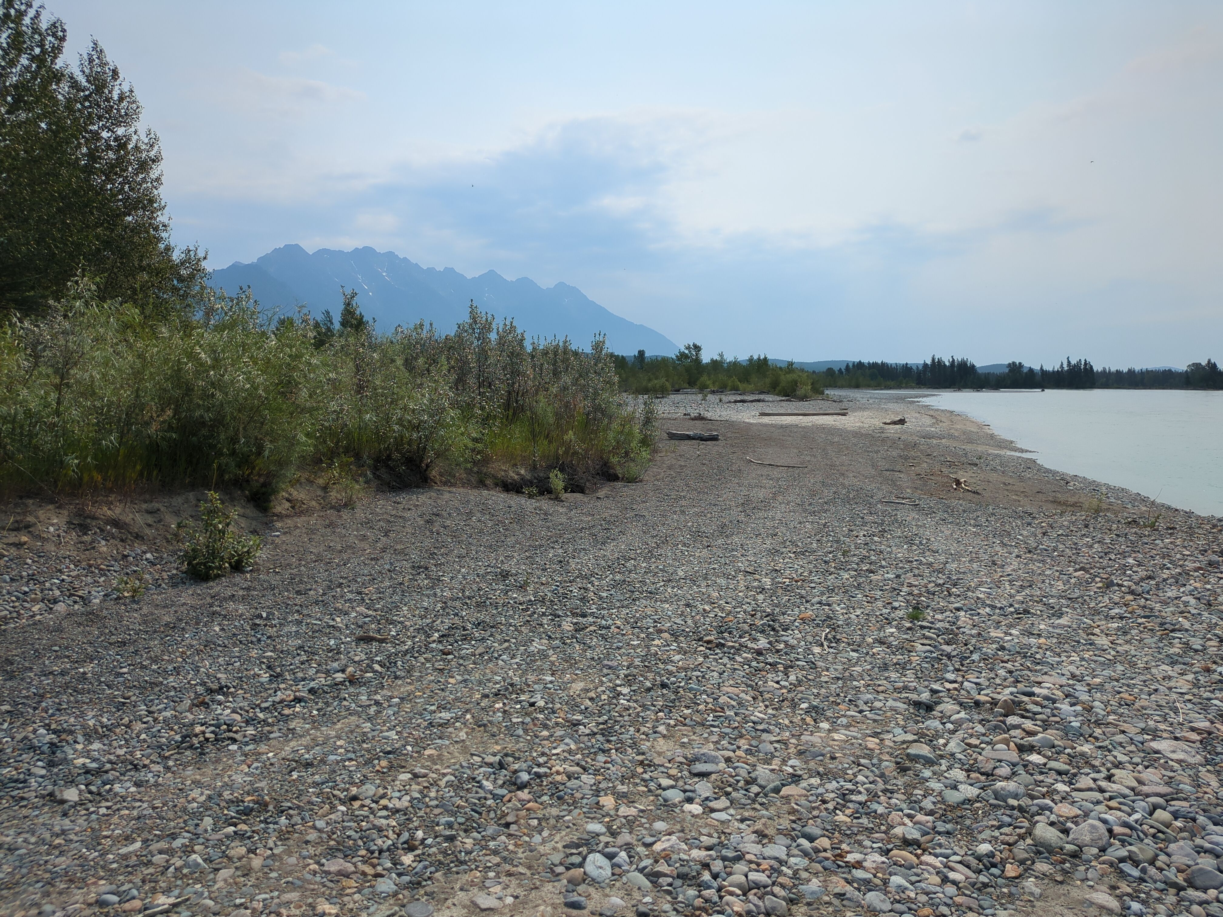 A view of the Rocky Mountains from the bank of river Kootenay.