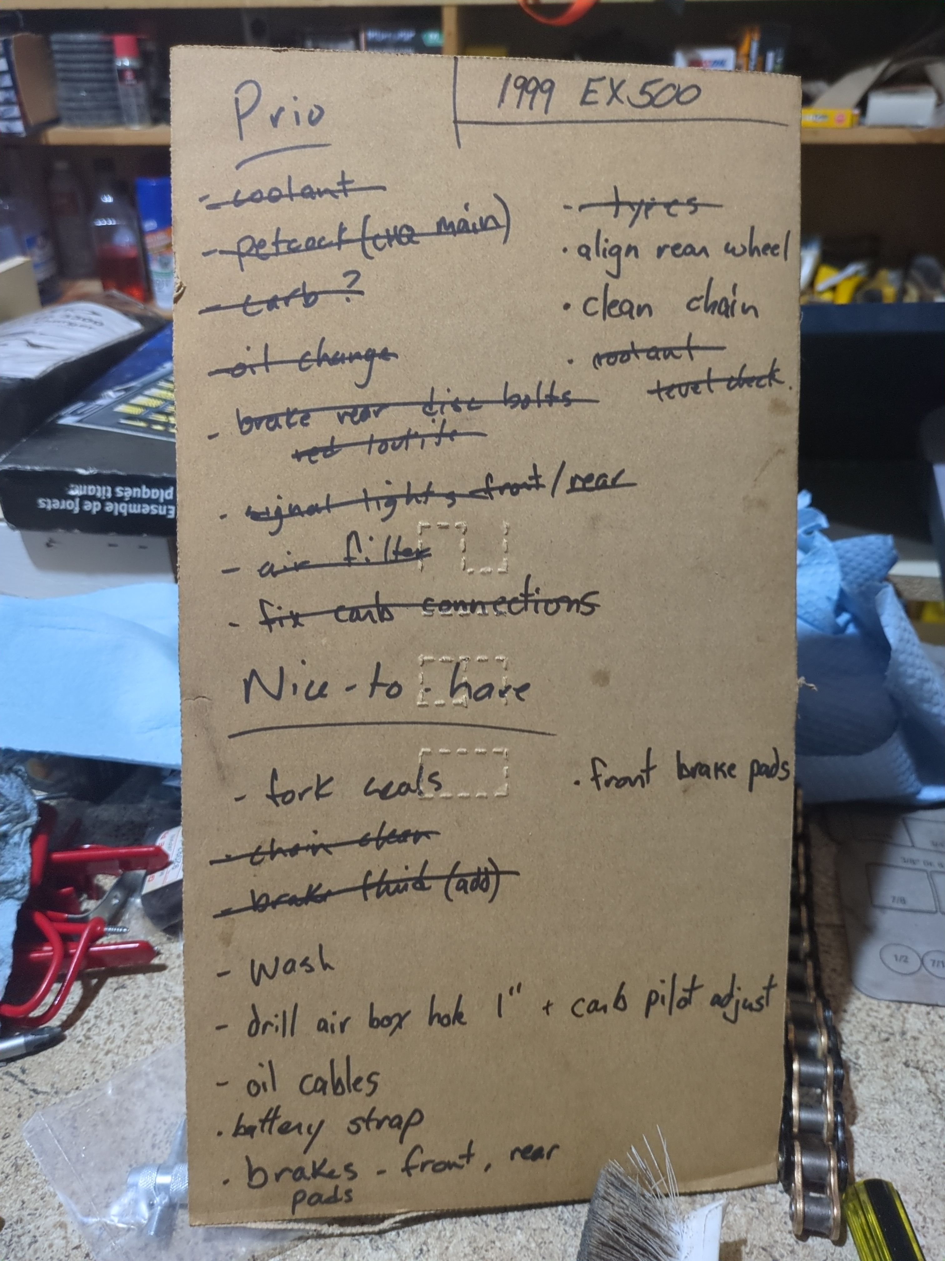 Check list of tasks to complete on the Kawasaki Ninja, most of them crossed off.